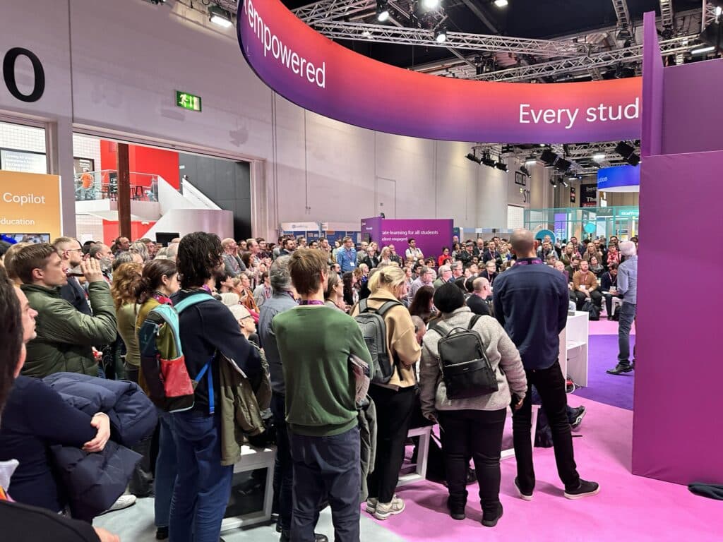 Talk Think Do team at the Bett UK 2024 exhibition booth