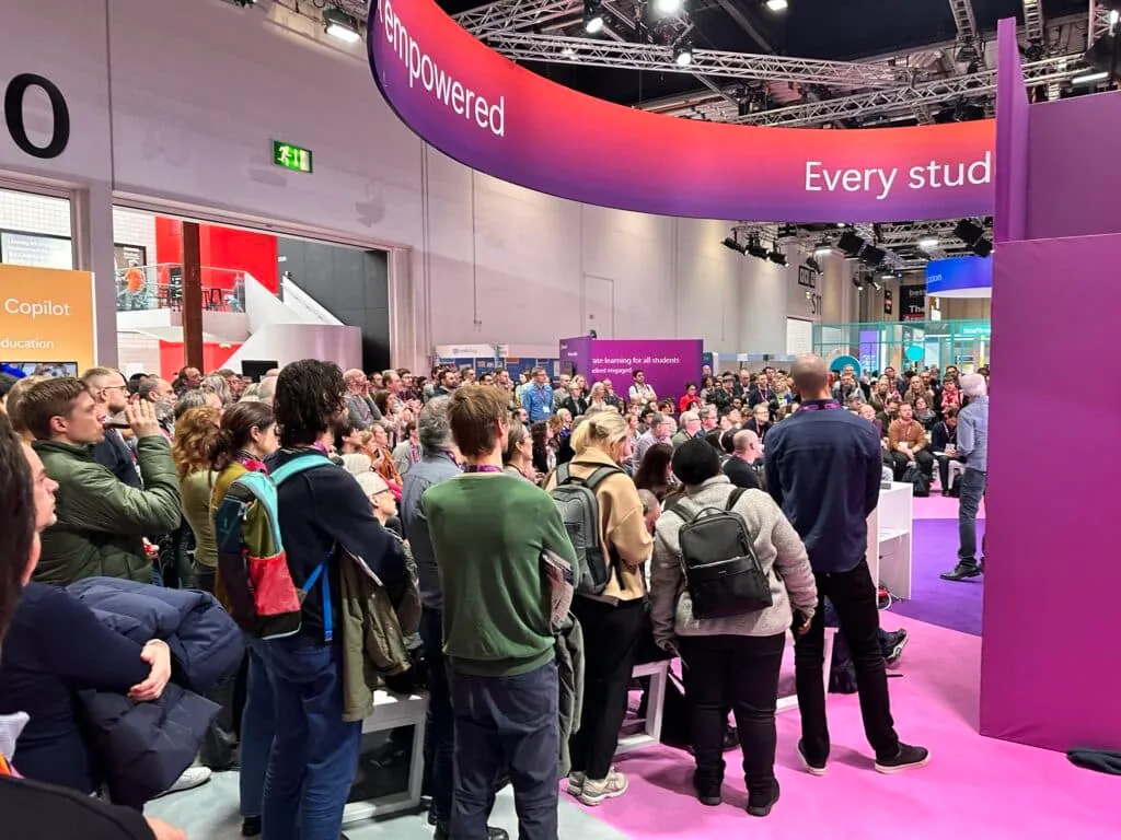 Talk Think Do team at the Bett UK 2024 exhibition booth