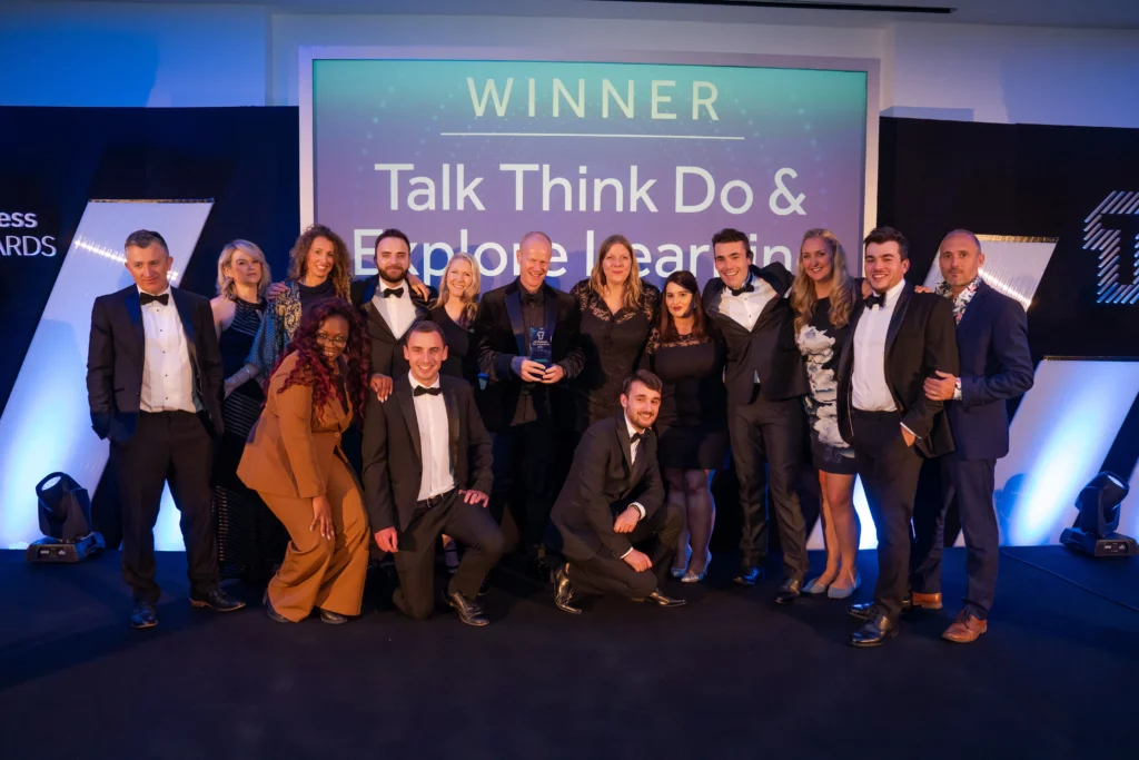 Talk Think Do team celebrating the UK Business Tech Transformation Award